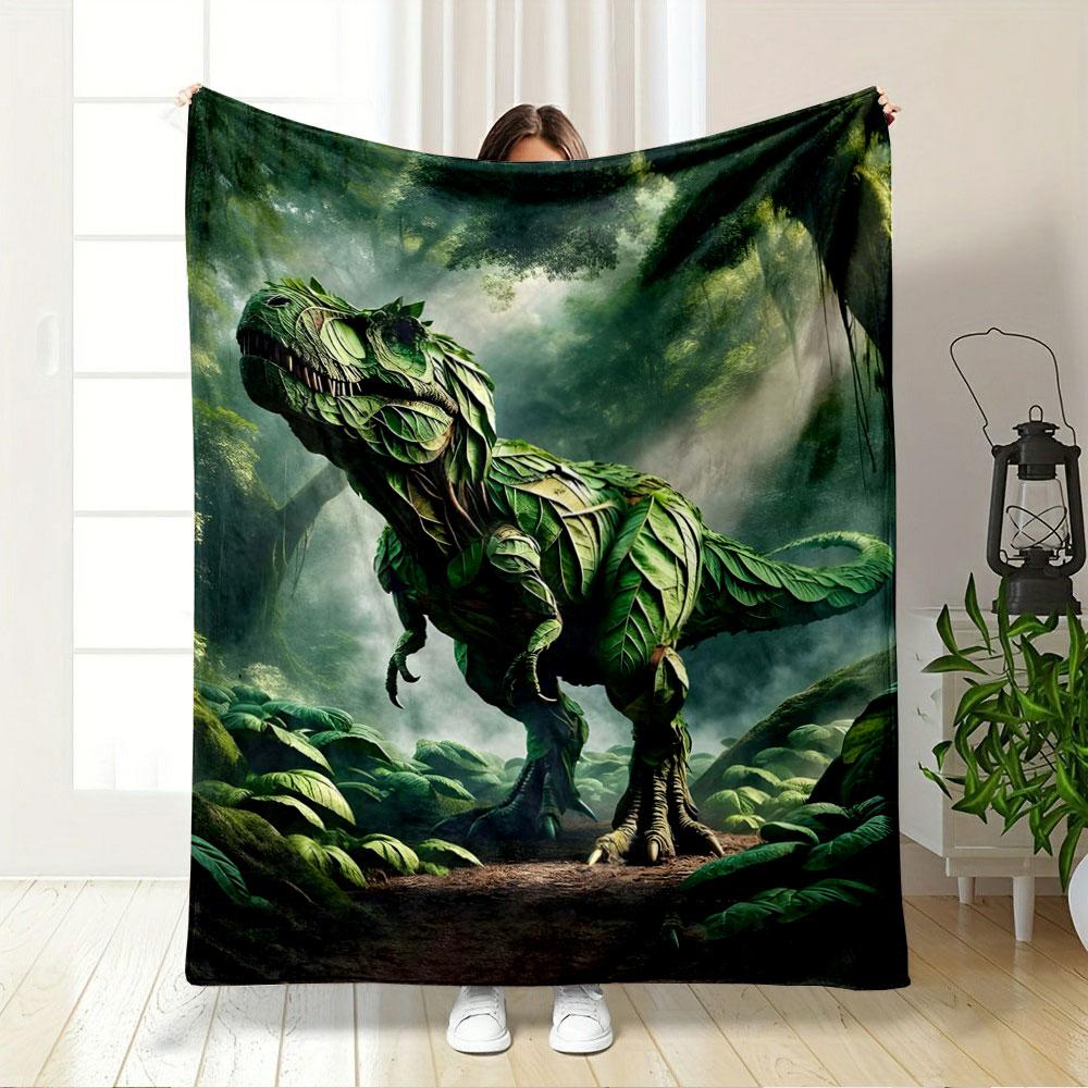 A dinosaur-shaped figure created entirely from overlapping green leaves. for all seasons blanket lunch break throw gift