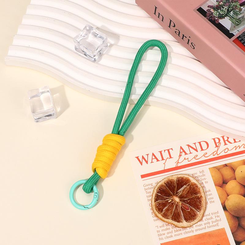 2025 Colorblock Anti-Verlust-Handytasche mit auffälligem geknotetem Handgelenkband