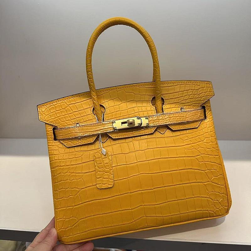 Pelle bovina primo strato motivo alligatore opaca portatile a spalla a tracolla borsa da donna premium transfrontaliera