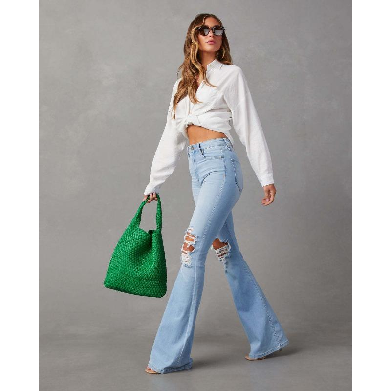 Wiosenne letnie damskie dżinsy z wysokim stanem i dziurami Street Spice rozkloszowane spodnie długie spodnie