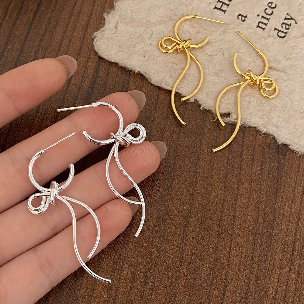 Trendy European & American Bow Pendant Stud Earrings with Tassels