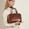 Vintage first-layer vegetable tanned cowhide commuter versatile handbag, genuine leather large-capacity bowling bag