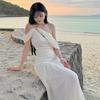 French white off-the-shoulder hollow pleated dress, high-end female summer pure desire wind vacation beach fairy long dress