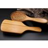 Natural wood paddle comb with bamboo bristles to detangle hair, suitable for women, men, and children, reduces frizz and massages the scalp