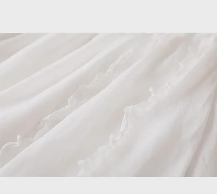 Jupe trapèze taille haute tendance en coton et lin: Mi-long avec bords volantés pour une coupe drapée et amincissante.