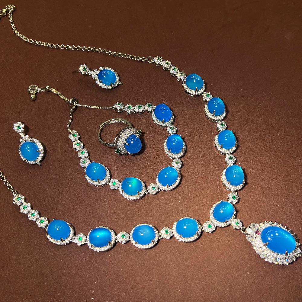 

Новый высококлассный китайский винтажный ювелирный набор с сапфиром и халцедоном