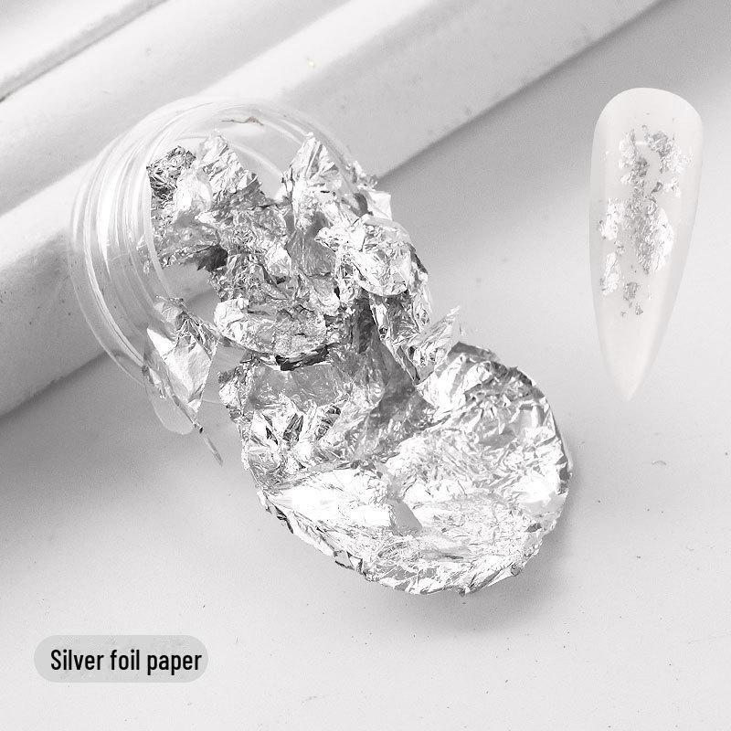 

Аксессуары для японского нейл-арта: Фрагменты золотой и серебряной фольги цвета шампанского для украшения ногтей foil paper серебряный