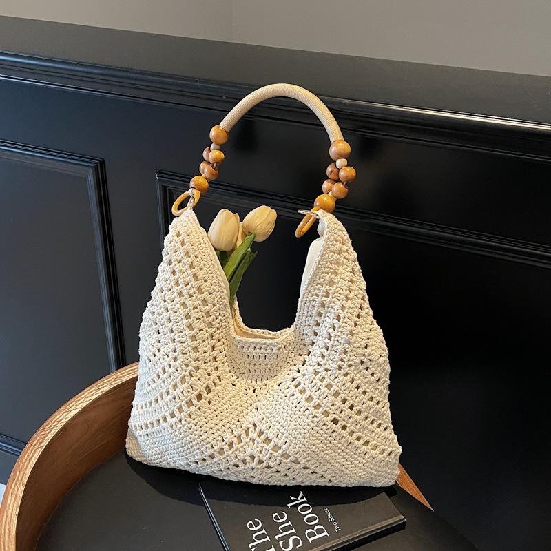 Seaside vacation beach bag women's new summer hollow bag commuting large capacity shoulder tote bag