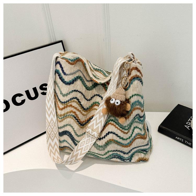 

Woolen texture bag women s spring 2025 new ethnic style plaid striped bucket bag contrasting color messenger bag білий