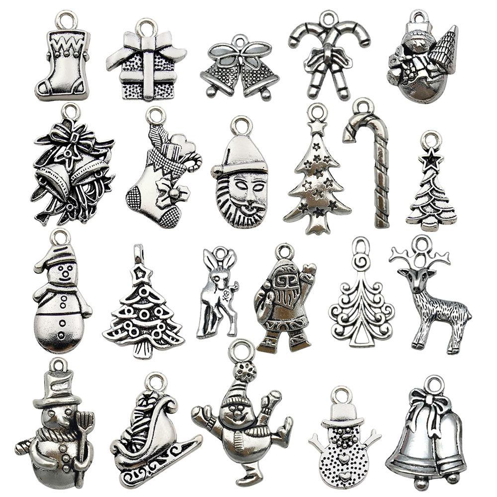100-teiliges Weihnachts-Tropföl-Legierungs-Schmuckzubehör: Weihnachtsmann, Schneemann, Glocke, Rentier Anhänger für DIY Armbänder.