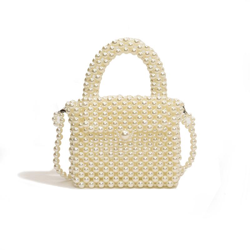 

Japanese streamlined and compact imitation pearl woven hollow women s mobile phone change bag 24 spring new shoulder messenger bag large білий