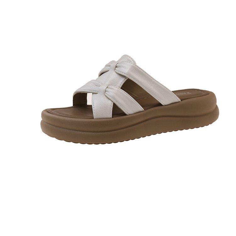 

Thick-bottomed cool slippers for women s summer outer wear 2025 new models with skirts to increase the height of leisure students stepping on shit 40