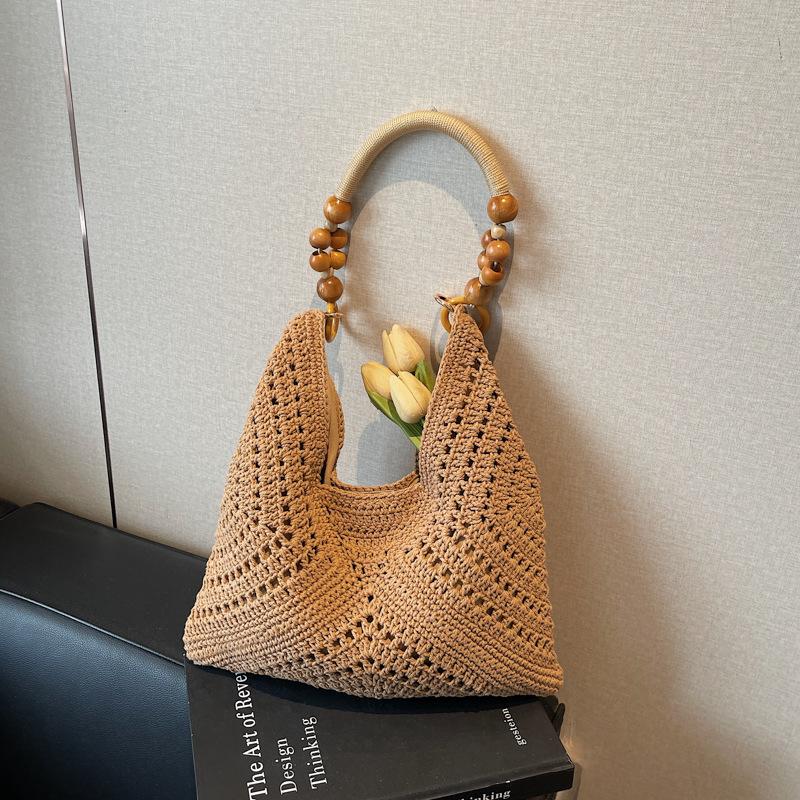 Seaside vacation beach bag women's new summer hollow bag commuting large capacity shoulder tote bag