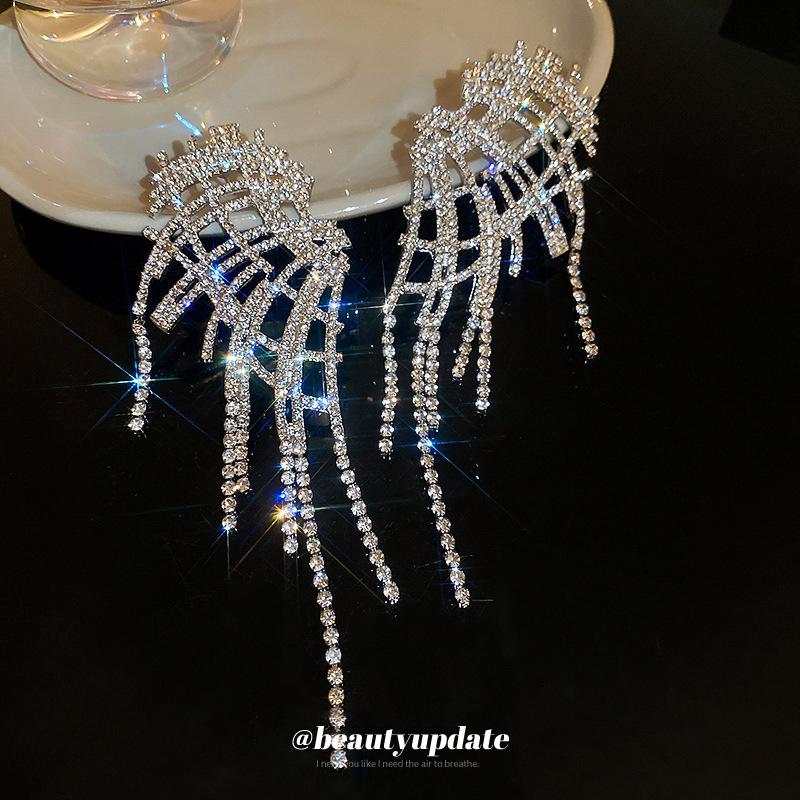 Silver needle with diamond wings hollow fringed earrings European and American exaggerated earrings temperament light luxury earrings women