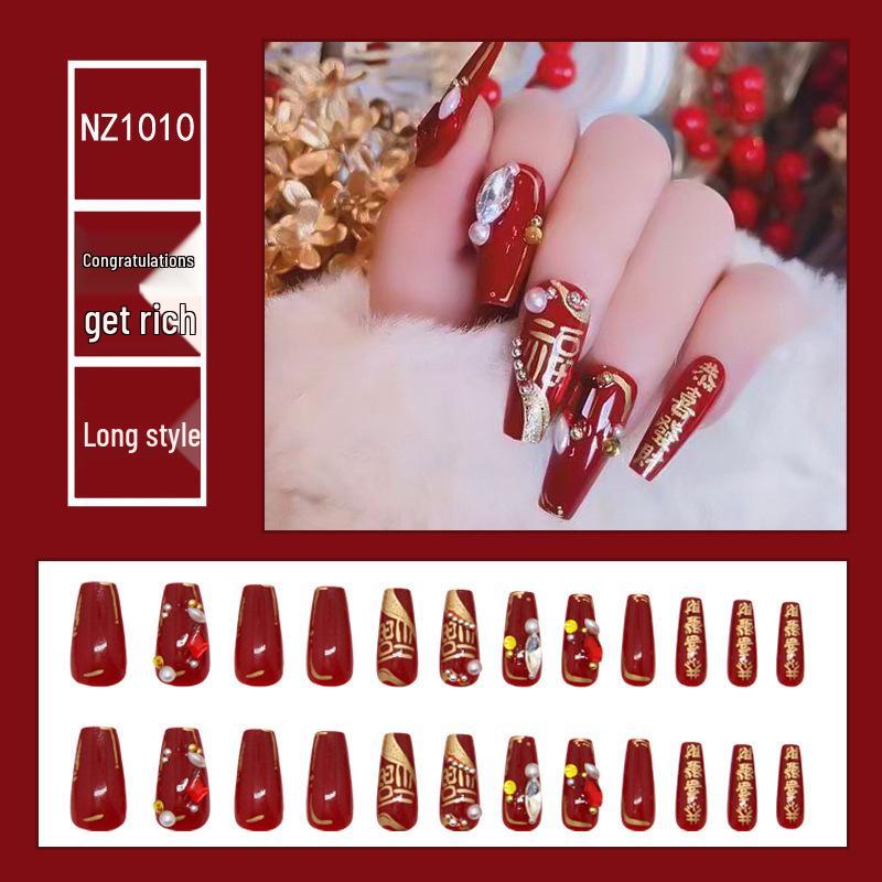 

Новогодний китайский маникюр на удачу: Красные блестящие стразы и жемчужные наклейки