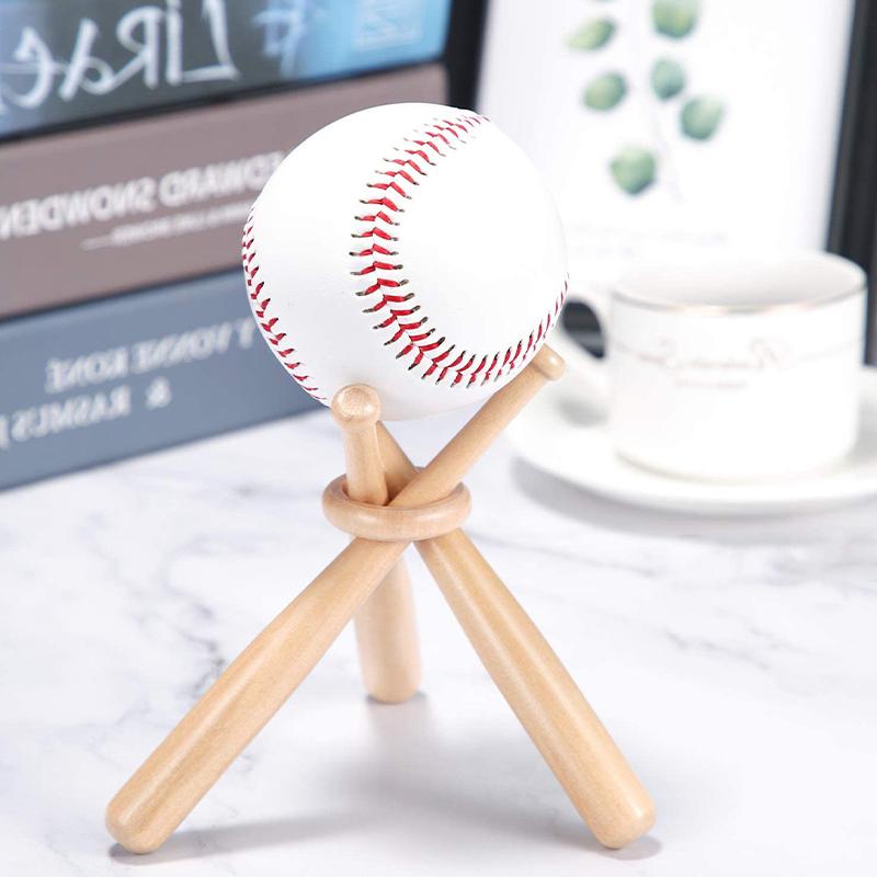 Miniaturní kulatá pevná dřevěná tyčka s dřevěným kroužkem Může být použita jako logo Baseballová pálka