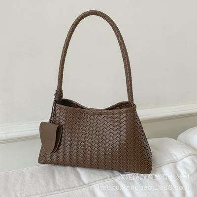 Premium Textur leichter Luxus gewebtes Muster Achseltasche Damen 2025 neue Temperament tragbare Schultertasche Pendler Eimertasche