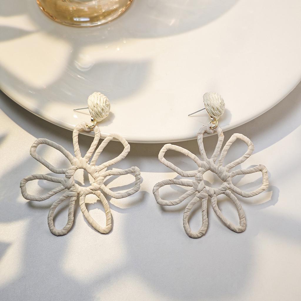 European and American cross-border summer vacation style earrings women, personalized color hand-woven raffia hollow flower earrings
