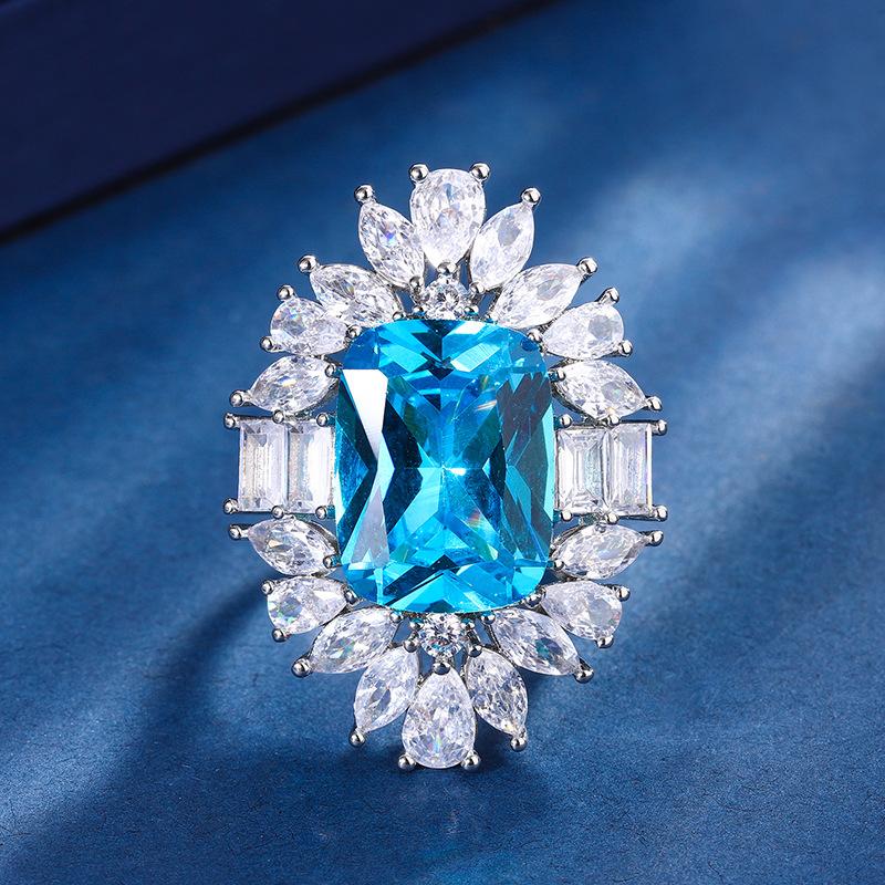 

Ювелирные изделия Медное базовое покрытие Имитация изумруда Аквамарин Толстый прямоугольный Легкая роскошь Темпераментный набор Женский 12 * 16