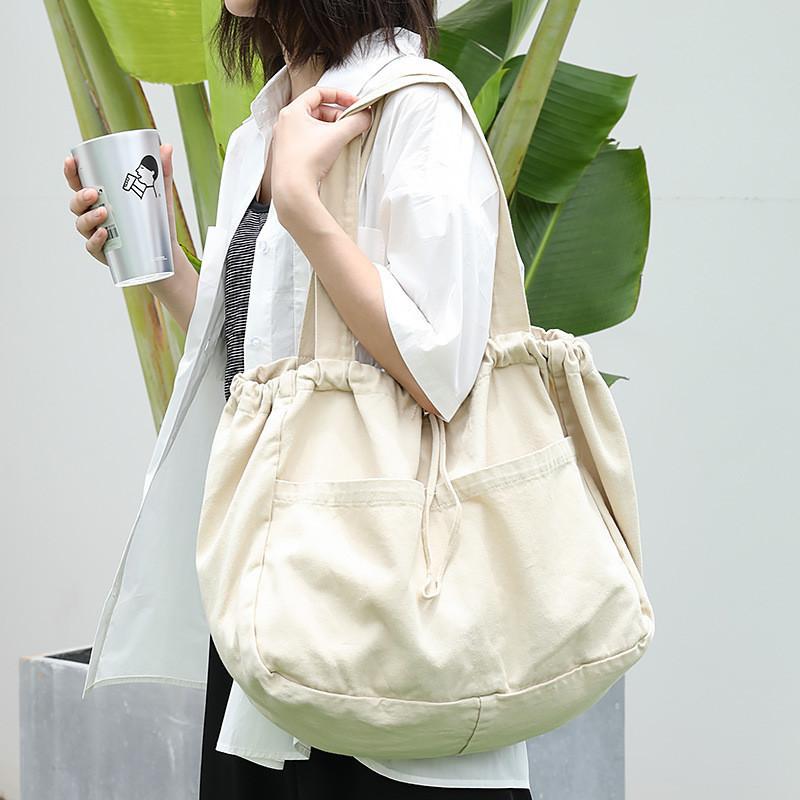 IELGY Japanese casual drawstring bundle handbag, retro washed canvas fashionable solid color shoulder women's bag