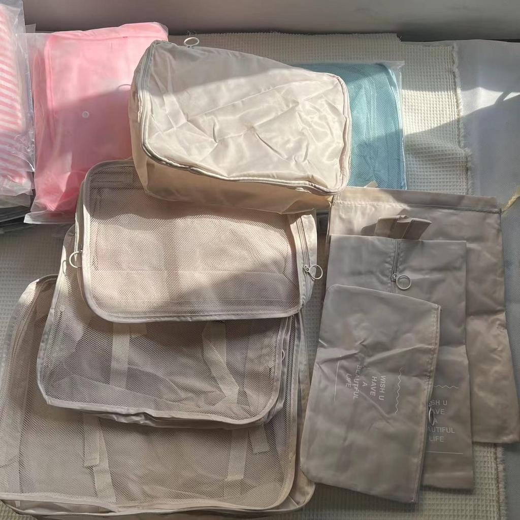 Seven-Piece Travel Packing Bag Set: Clothes, Underwear, Cosmetics, and More.