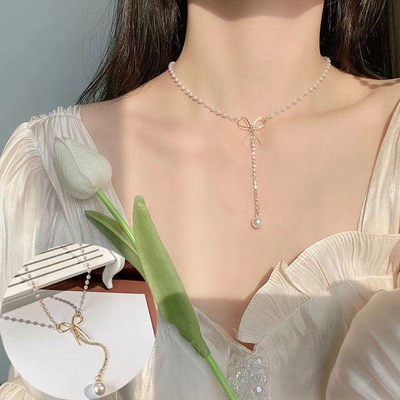 

Элегантное женское ожерелье с кисточками из жемчуга и бабочек — нишевый дизайн, универсальная цепочка на ключицу