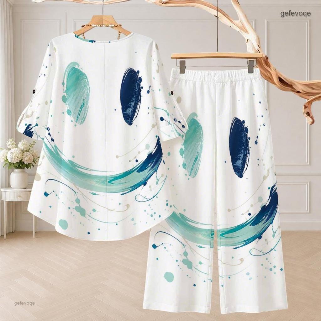 Women Plus Size White Printed Two Piece Set Round Neck Half Sleeve High Low Top Wide Leg Pants