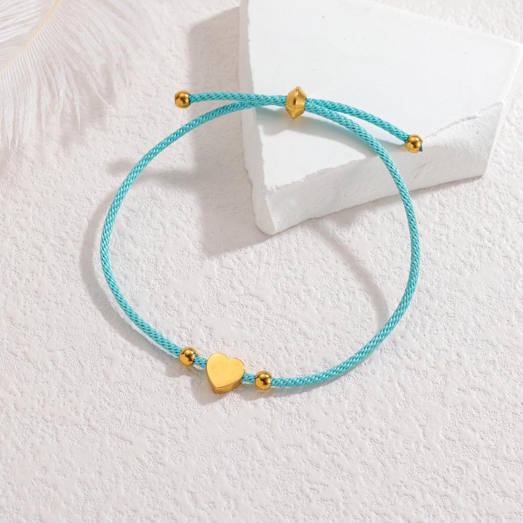 Minimalistisches blaues Seilarmband mit Herz-, Männchen- und runden Anhängern aus Edelstahl