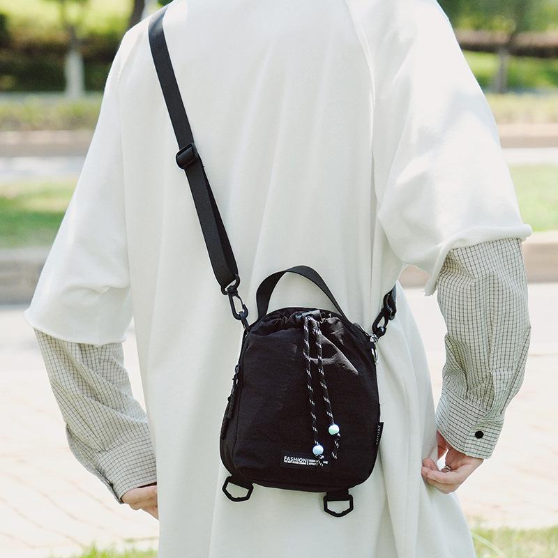 Dual-purpose messenger water cup bag outdoor sports backpack niche leisure shoulder bag light hiking kettle bag