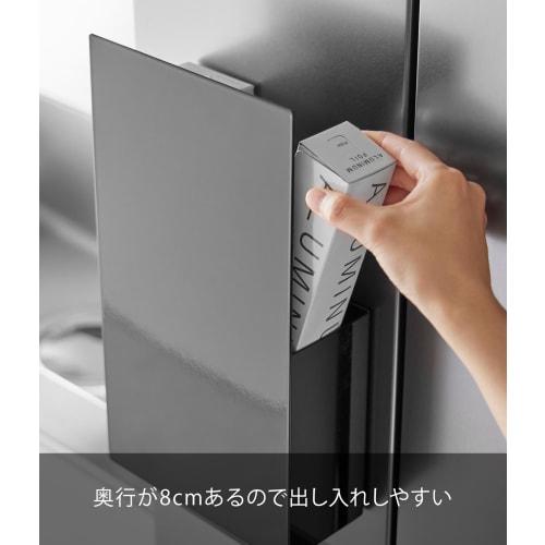 Yamazaki Tower, a hidden magnetic wrap holder in black, measuring 17.8cm W x 8.3cm D x 33.5cm H. This floating, hidden storage lap stand is part of th