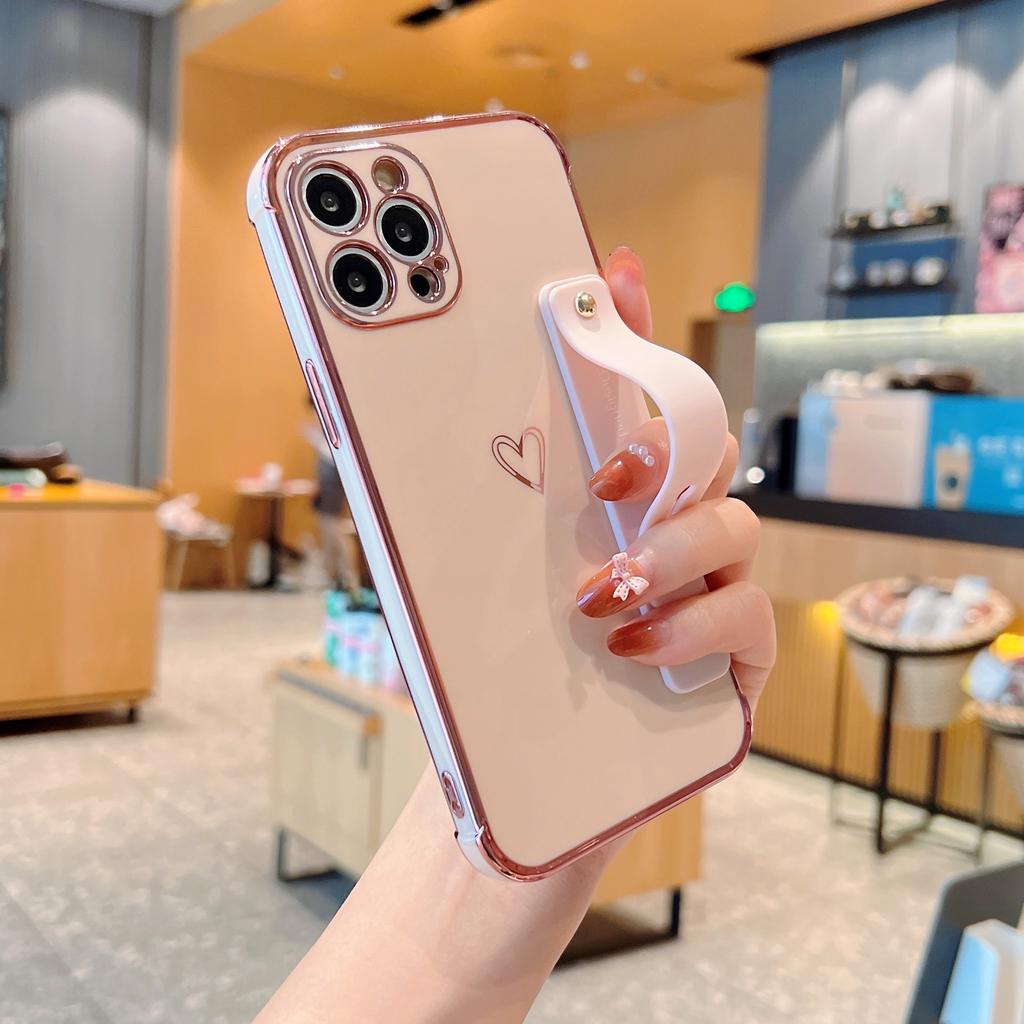 Applicable to iphone17pro mobile phone case Apple hollow love + bracket wristband new 15 Apple 16promax