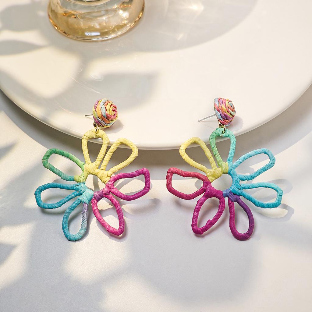 European and American cross-border summer vacation style earrings women, personalized color hand-woven raffia hollow flower earrings