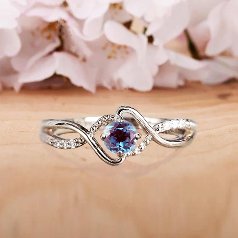 Huitan Elegant Women Ring Twist Design Inlaid Sparkling Blue CZ Fashion Party Engagement Noble Lady Accessories Delicate Jewelry
