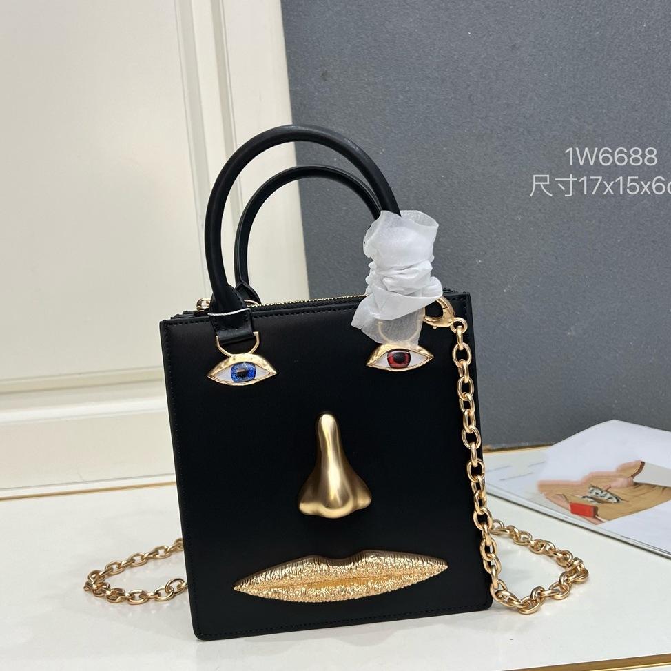 26 trendy new schiap face women's bag plain weave cowhide chain design sense hand-held tote bag