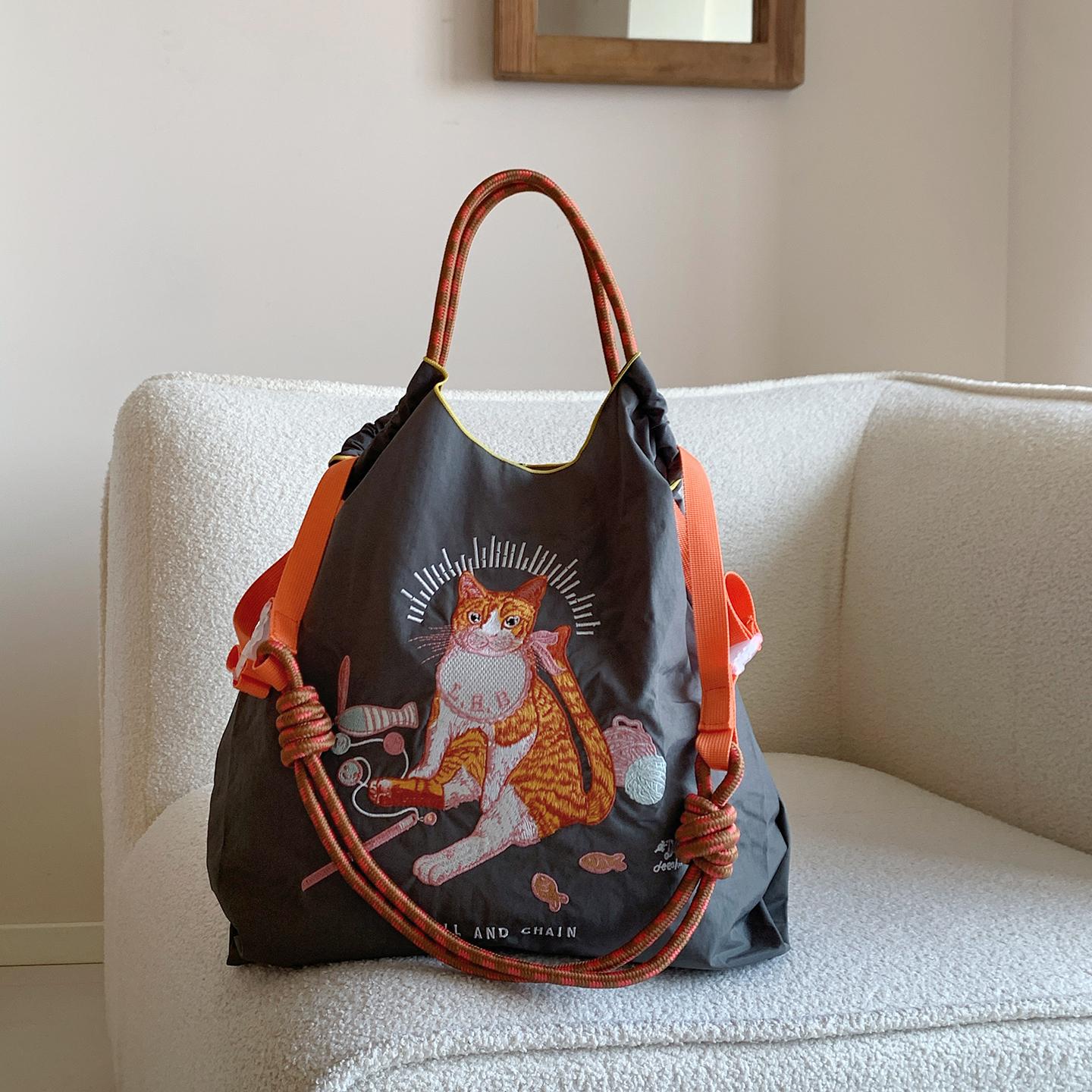 Nieuwe mode dameslijn bal kat geborduurde boodschappentas nylon forens schoudertas dames crossbody tas M black