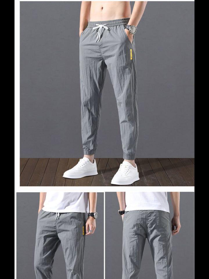 2023 Men's Korean-Style Ice Silk Casual Pants, Quick-Drying, Trendy, Loose-Fit Nine-Point Sports Pants for Summer.