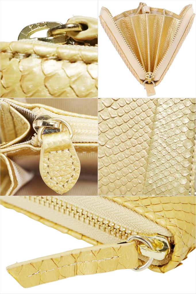 This gold long wallet for men and women is made from a single piece of genuine snakeskin leather. It features a round zipper, a coin purse, and card