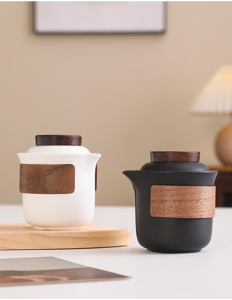 Portable Travel Tea Set: Teapot, Four Cups, and Storage Bag for Outdoor Camping.