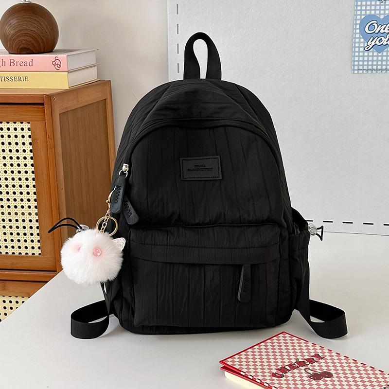 School bag junior high school girls large capacity solid color light primary school backpack high value girl versatile backpack