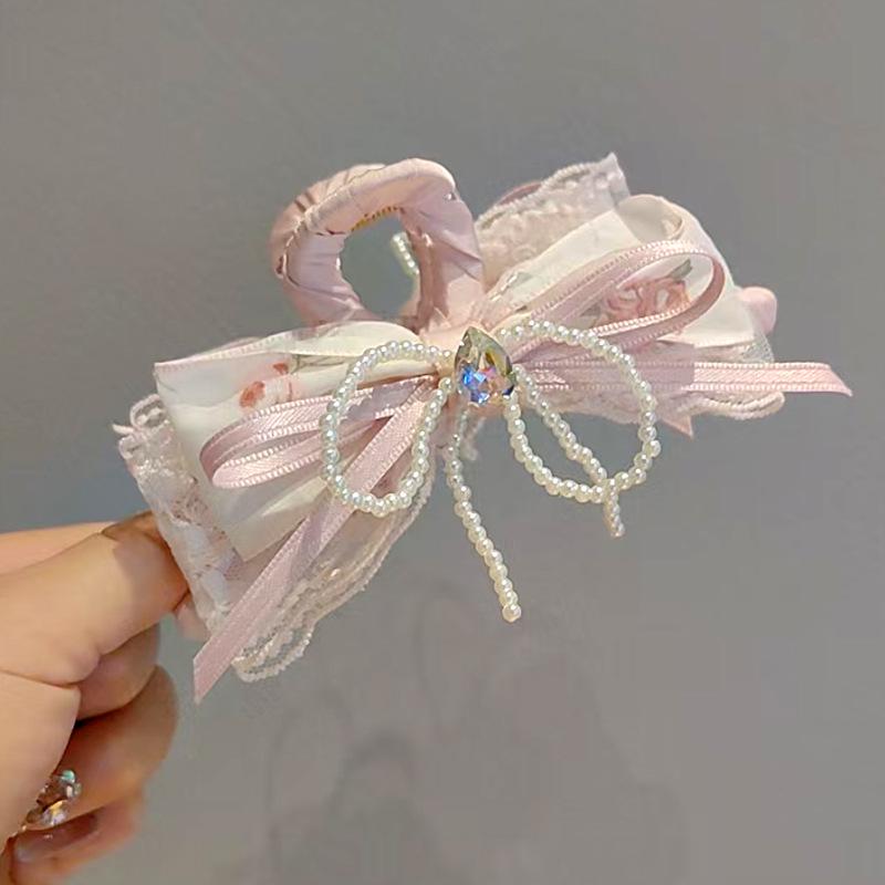

Elegant Pearl Rhinestone Bow Claw Clip: High-End Women s Shark Clip for Voluminous Updos