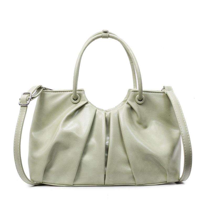 Korean version of foreign style niche design pleated handbag bag women's versatile foreign style advanced sense oil wax leather commuter messenger bag