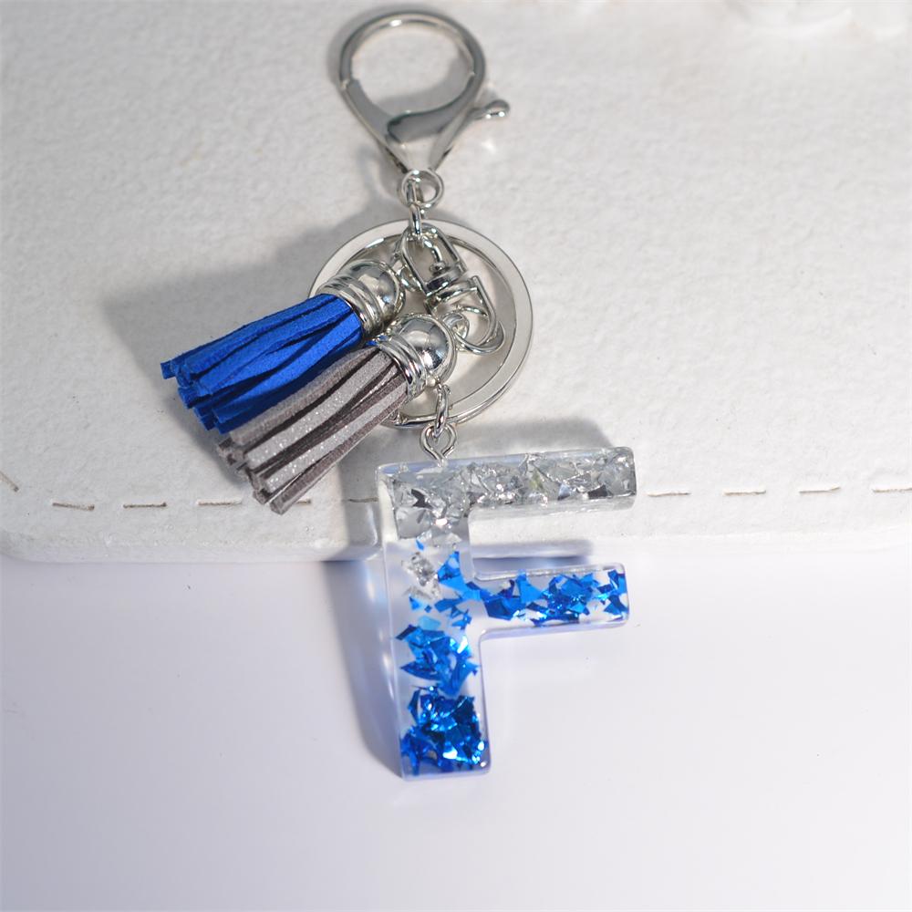 Креативные брелки из смолы с 26 буквами и кисточками — фото 13