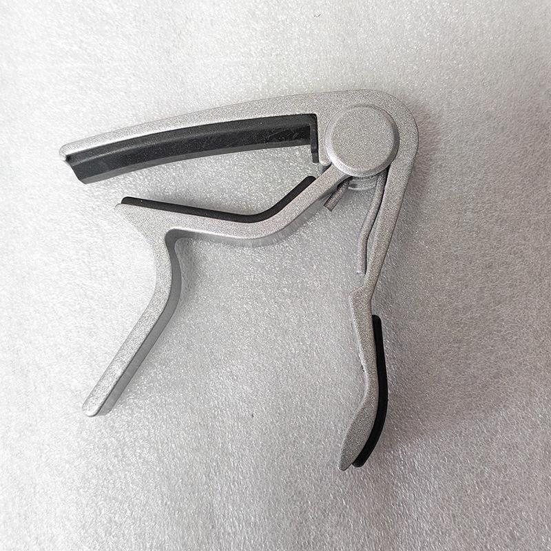 

Aluminum Alloy Capo for Guitar and Ukulele - Tone Changer Clip for Folk, Wood, and Electric Guitars срібний