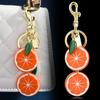 Women's fruit key chains, fashionable and creative lemon and orange slice bag pendants, keychains
