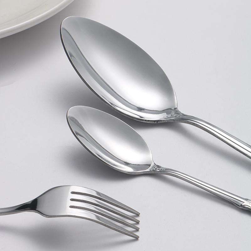 40pcs Elegant Silver Cutlery Set Features Stainless Steel Openwork Handles and Includes Forks, Spoons, and Knives. Perfect for W