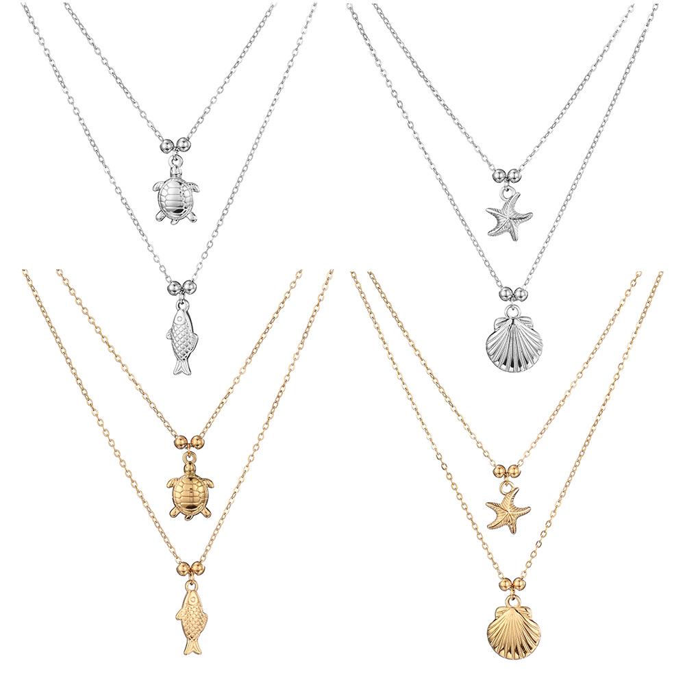 Collana in Acciaio Titanio a Due Strati Antiossidante Serie Oceano con Ciondoli Tartaruga Marina, Pesce e Stella Marina per Donna.