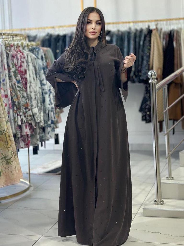 Glitzerndes Langarmkleid mit Rundhalsausschnitt und Bindedetail am Rücken