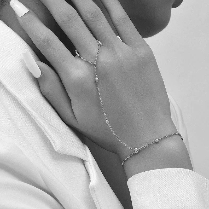 

Elegant Zirconia Ring Bracelet: Versatile, Adjustable Finger Chain Jewelry for Women