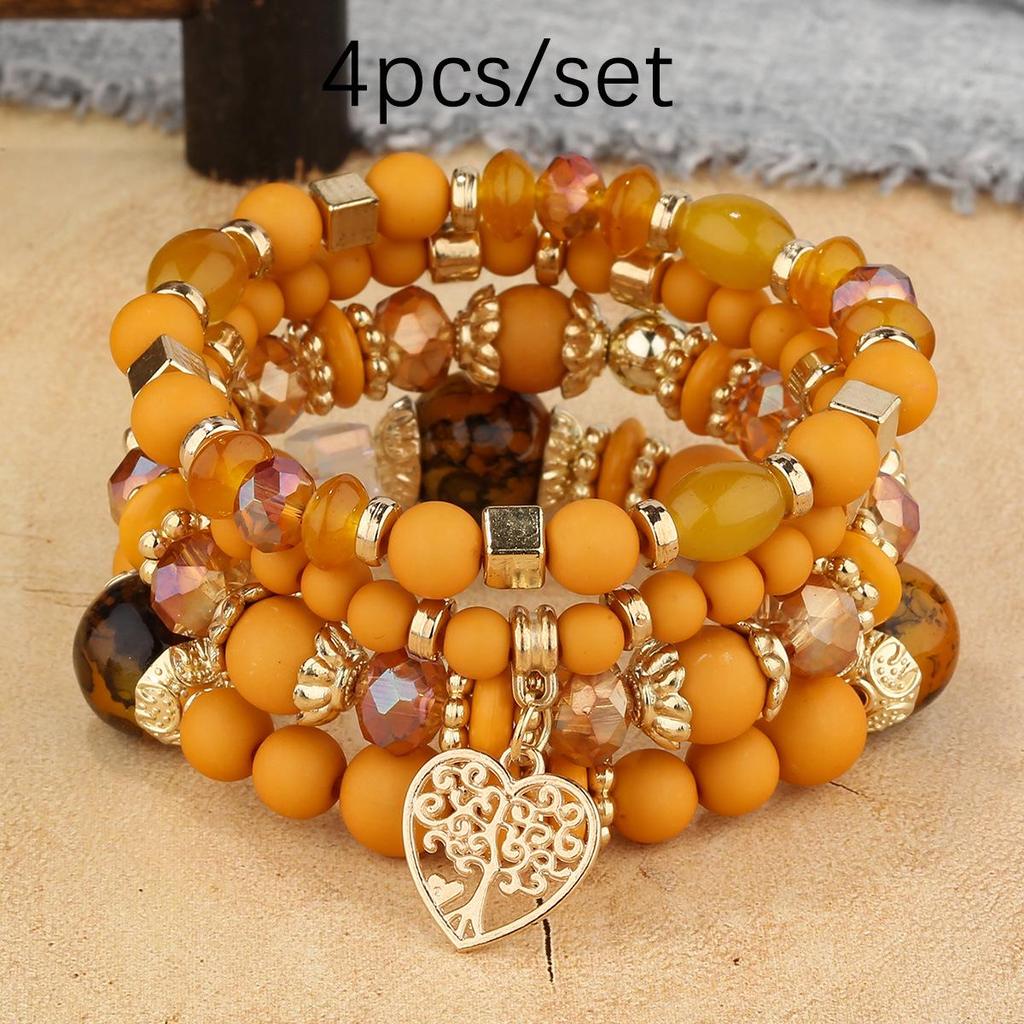 Bohemian Multi-Layer Tassel Bracelet Set with Hollow Heart Pendants and Glass Beads.