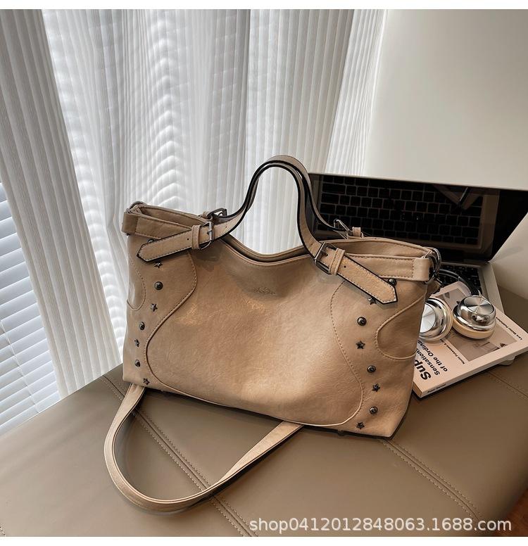 Retro women's handbag 2025 new niche retro locomotive wind rivet tote bag casual shoulder messenger bag